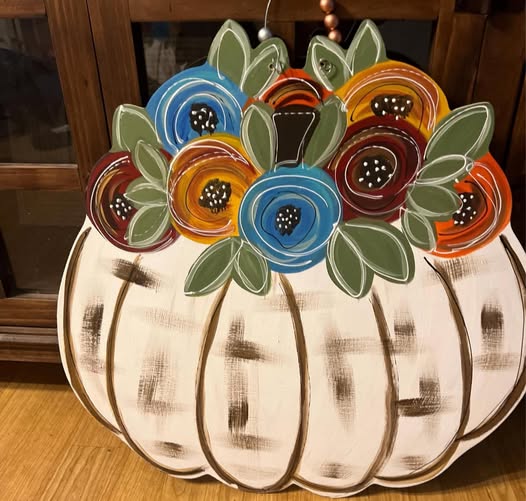 floral top pumpkin door hanger